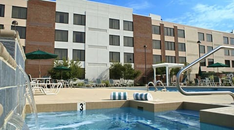 Lounge beside the sparkling pool with plenty of seating options.