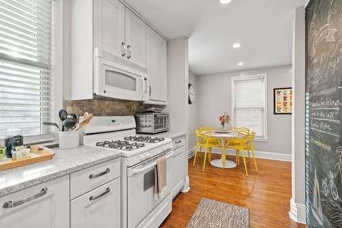 Your fully equipped kitchen with modern appliances and charming breakfast nook creates the perfect space for morning coffee and home-cooked meals.
