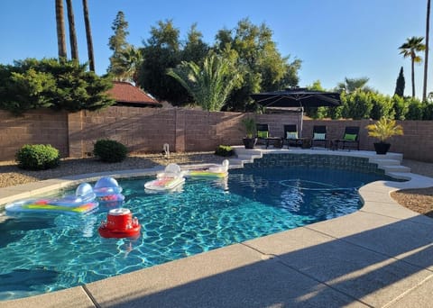 Beautiful pool. Chaise lounge chairs with towel covers 