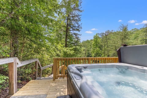 - Soak in the private hot tub surrounded by forest views   - Unwind on the wooden deck and breathe in fresh mountain air   - Perfect peaceful retreat after a day of exploring nearby trails