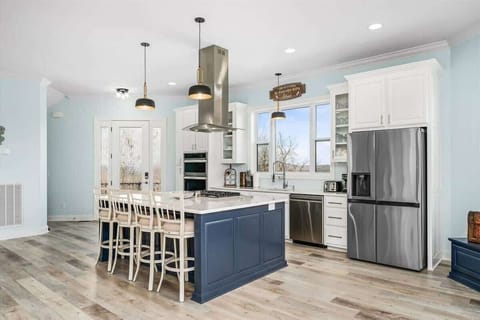 The stunning chef's kitchen boasts brand-new, high-end appliances and is fully equipped to prepare meals for families of any size.