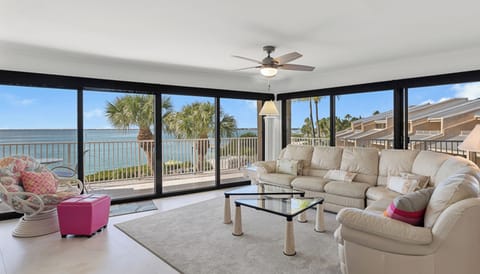Oceanfront living room with wraparound windows