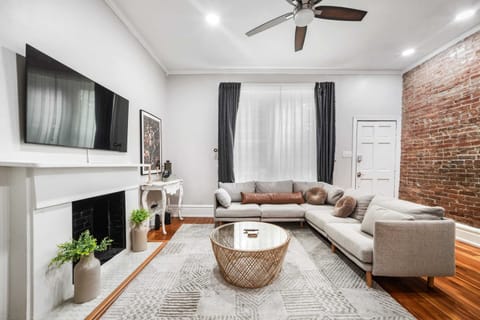 Living Room: The living room features a plush sofa and TV, creating a perfect space to unwind and enjoy your favorite shows in comfort.