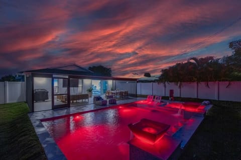 533 Posh Paradise; Where radiant hues reflect in the tranquil waters as the sun bids farewell