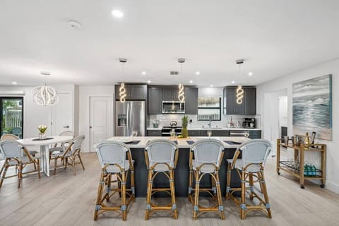 The kitchen island, where conversations flow as easily as the flavors, creating moments to cherish