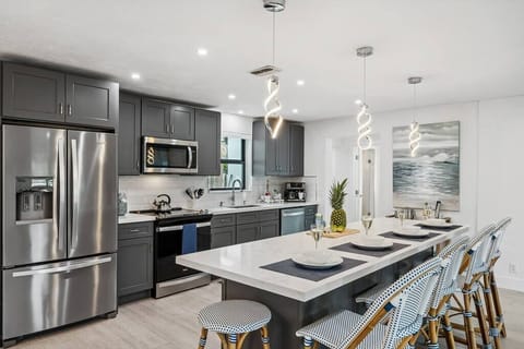 Featuring a modern kitchen where form and function seamlessly combine, making culinary dreams come true