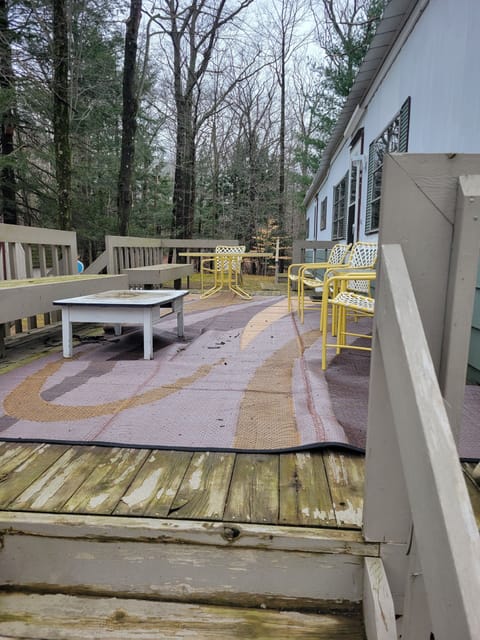 Deck with seating for over 6 people and eating table