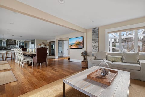 You and your guests can watch a large flat-screen TV from plenty of comfy spots.