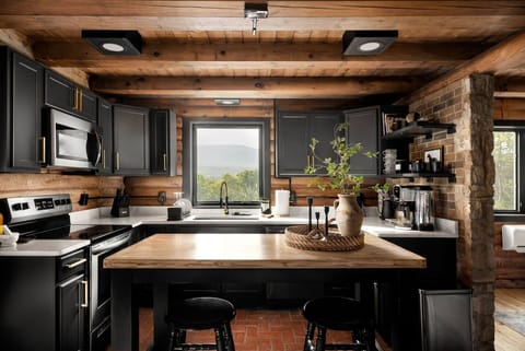 Kitchen Charm: Cook up a storm in our fully equipped kitchen, where rustic meets modern convenience.