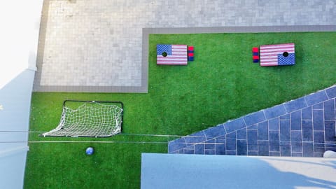 End your beach days in a peaceful backyard setting, perfect for unwinding after a day at the shore.