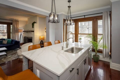 Every direction in the kitchen offers window views, large oversized granite countertops, large sink, real plants, and an open concept kitchen where you can still talk to your family who can hang out there, in the dining room or the living room.