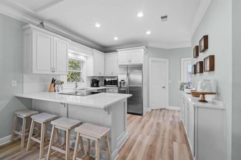 Additional seating for four at the  kitchen bar.