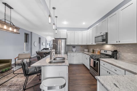 Another view of this spacious kitchen with plenty of storage, beautiful granite countertops and stainless steel appliances!