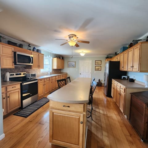 Huge kitchen with plenty of room to cook.  Eat in bar. stocked 