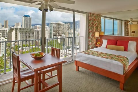 Unit w/ Queen size bed, dining area, and kitchen