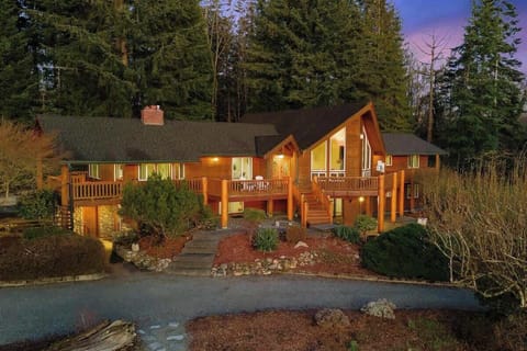 Arrive at a private, well-kept home surrounded by trees and gardens—quiet and tucked away.