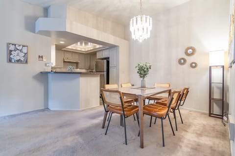 Whether it's a leisurely breakfast or a dinner gathering, the layout fosters easy interaction among guests