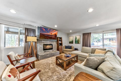 Sink into plush sectional seating by your cozy fireplace, where mountain views and warm ambiance create perfect moments for relaxation.