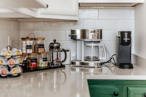 [Ridgeview Main Floor] You will have no excuse for not being well-caffeinated. Both houses have a full coffee bar.