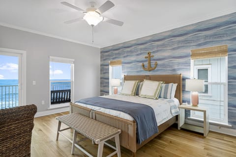 The primary suite spans the entire front of the home with fantastic views and sounds of the waves to lull you to slumber.  This room is also furnished with a full-over-twin trundle bed in case little ones need to room in.