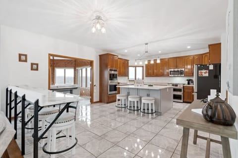 Kitchen, bar sitting area, and the entrance to one of the 180 degree panoramic view rooms