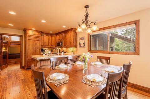Dining table expands with additional chairs for seating up to 10