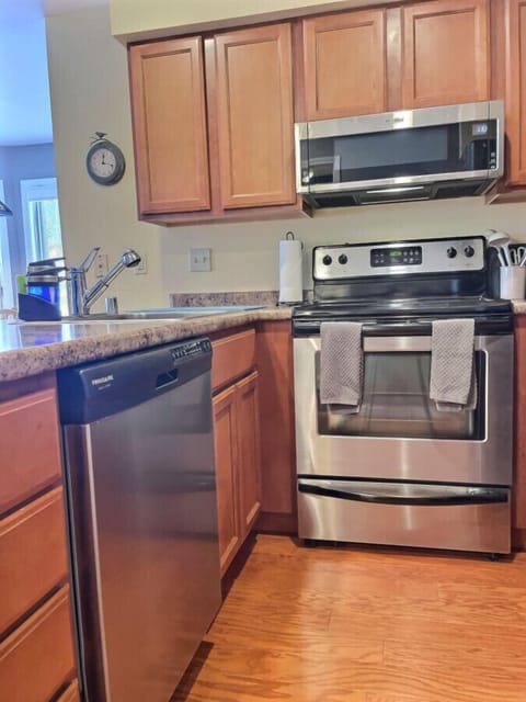 Step into our charming rustic kitchen, where modern amenities blend seamlessly with timeless country charm, creating a cozy and inviting culinary space.