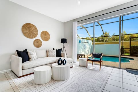 Indoor-Outdoor Living, Open-concept great room with sliding glass doors to private lanai and pool