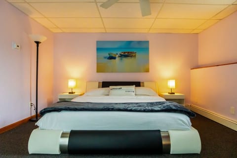 The bedroom comes with a king size bed and three comfortable pillows. 