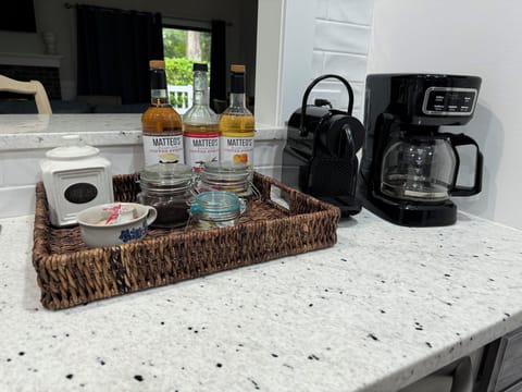 Mr. Coffee drip and Nespresso, plus syrups, sweeteners, creamers, and coffee