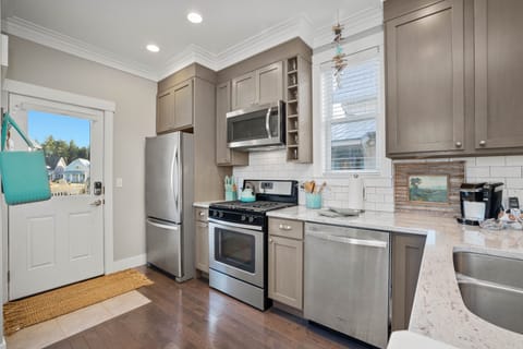 The kitchen is fully stocked for your cooking needs.