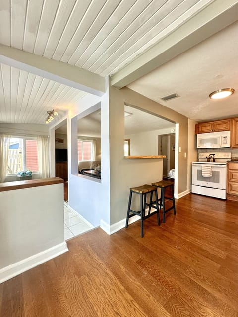Dining table with 3 seating and 2 bar stools.