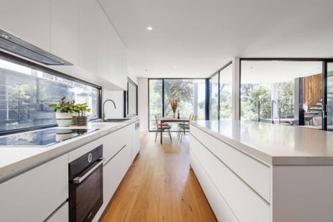 Cook up a feast in the sleek white kitchen. It’s fully equipped for your holiday catering.
 
