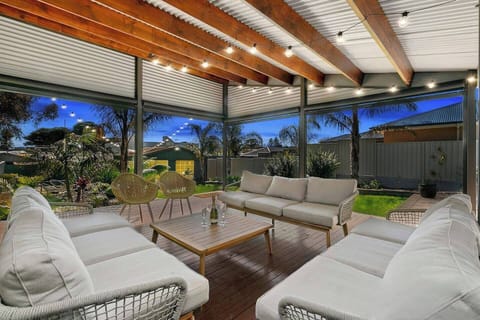 A cosy lounge setting on the undercover deck offers an idyllic spot to sip your morning cuppa or cheers with a glass of wine come evening.