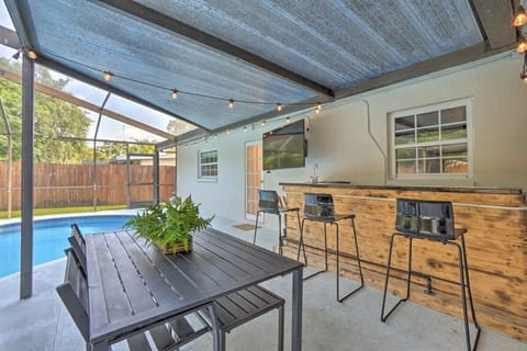 Stir up some drinks or watch the flat-screen TV at the outdoor bar and dining area in the back yard.