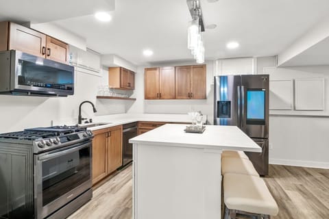Enjoy the stainless steel smart appliances in the kitchen, including a Samsung refrigerator.