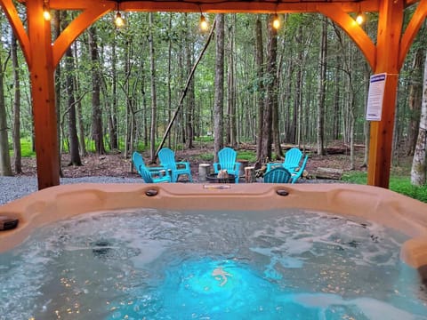 Unwind anytime in your private hot tub—perfect for soothing soaks under the stars