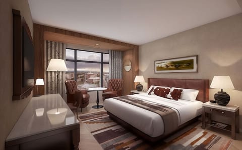 Unwind in a plush bed with calming city views.