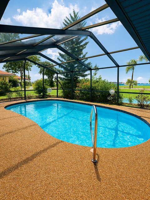 Indulge in our heated screened pool with lounge chairs & dining table for 6.
