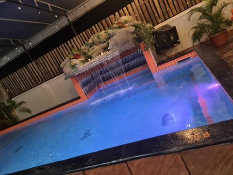 Pool with lights and waterfall