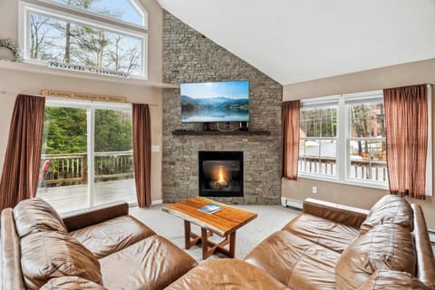 Living room with large sectional couch and gas fireplace