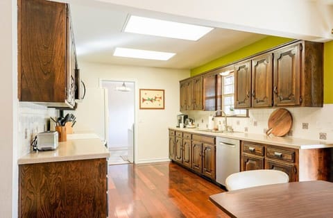 A sleek wooden cabinets and stunning countertops.