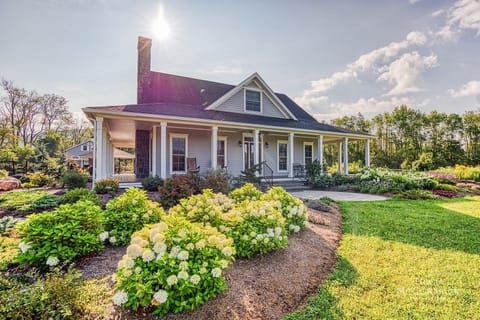 Enjoy 60 private acres with sweeping mountain views. 3-bed, 3.5-bath  including a heated pool, hot tub, central AC, and a full gym. 