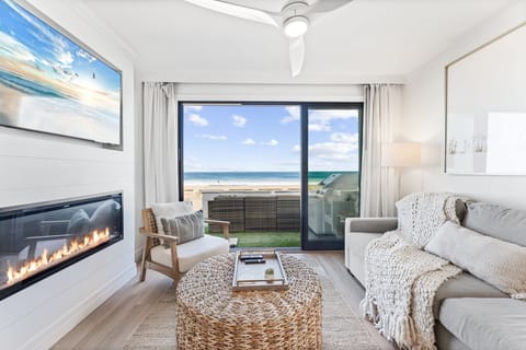 Step out onto the porch right from the living room's sliding glass doors. You can also enjoy the gorgeous ocean views from the comfortable sofas indoors.