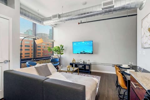 Living area with sofa bed and TV