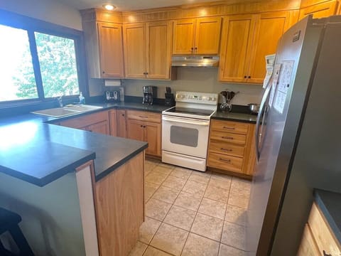 Second view of the kitchen that includes a glimpse of the outside!