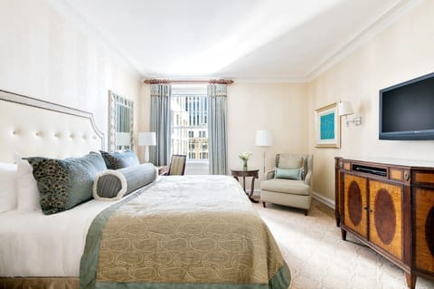 Unwind in a plush king bed with soothing city light.