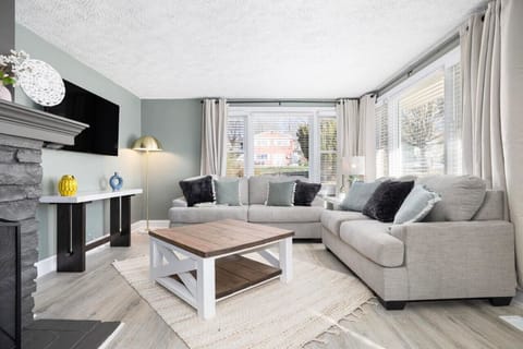 Relax and unwind in this cozy living room with all-new furnishings, perfect for quality time or catching up on your favorite shows.