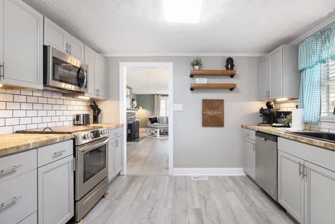 Fully equipped with modern appliances, this kitchen is ready for all your home-cooked meals and quick snacks.