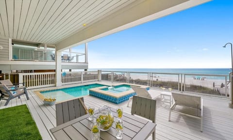 Relax on your private deck with pool, hot tub, and stunning oceanfront views stretching to the horizon.